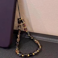 Phone Strap de Cristal Preto e Ouro: Luxo e Proteção 📱✨ - imagem 2