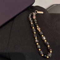 Phone Strap de Cristal Preto e Ouro: Luxo e Proteção 📱✨ - imagem 1